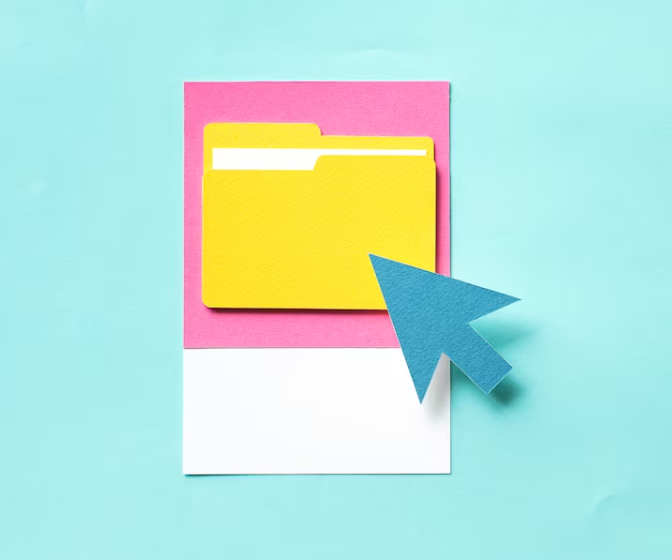 yellow folder in pink square and mouse arrow on it on blue background