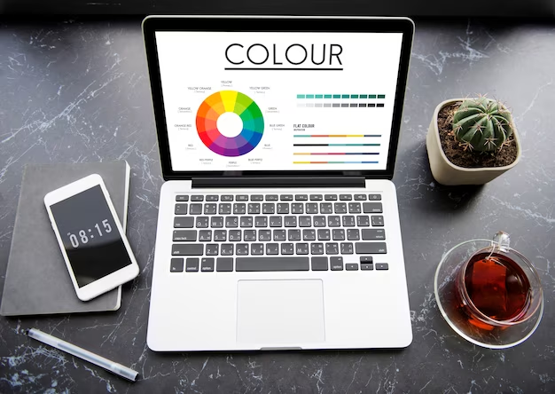 Laptop displaying a color wheel on the screen, a color palette, and the word 'color' above